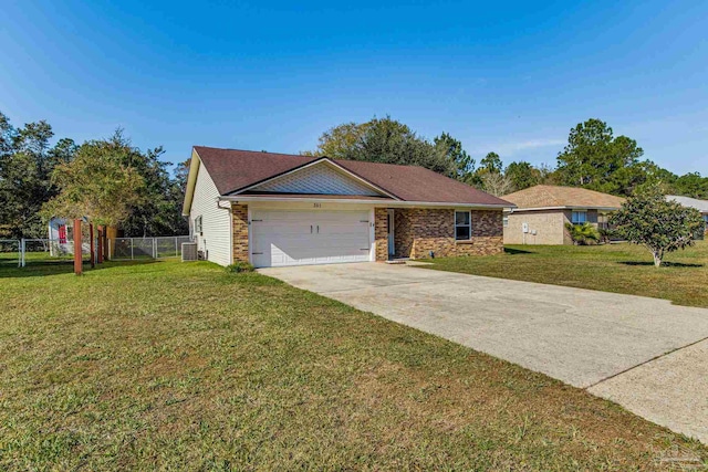 ranch-style home with a front yard, central AC, and a garage