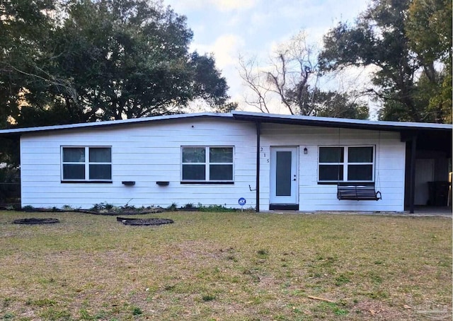 ranch-style home with a front lawn