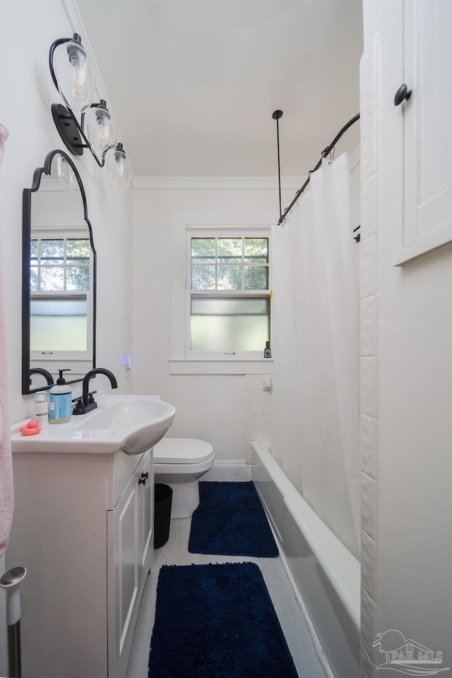 full bathroom with vanity, crown molding, toilet, and shower / bathtub combination with curtain