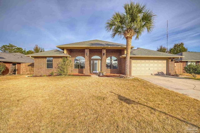 view of front of home featuring a garage and a front yard