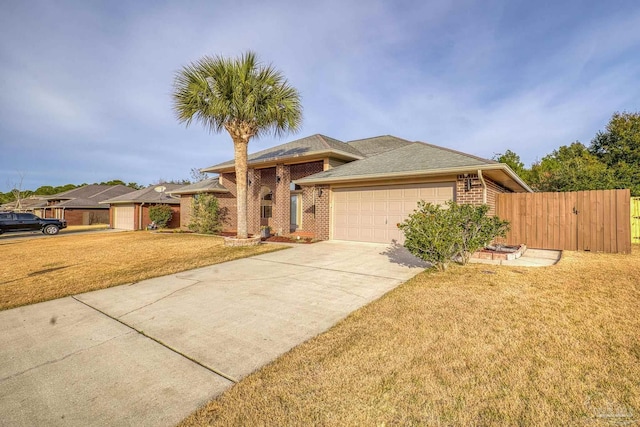 view of front of house with a garage and a front yard