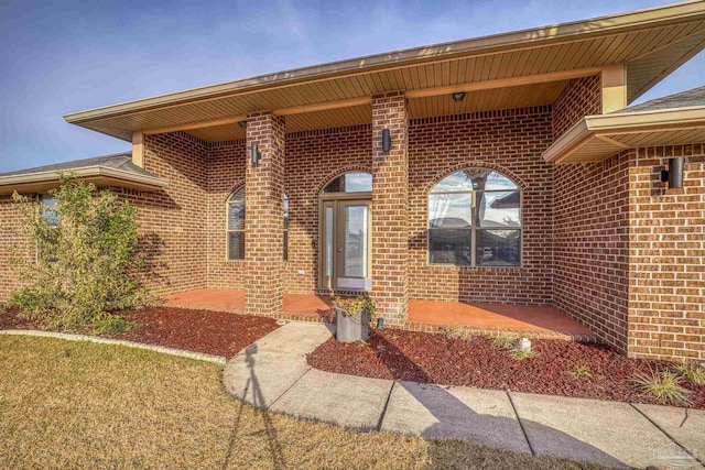doorway to property with a patio