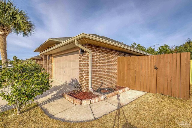 view of side of home featuring a garage