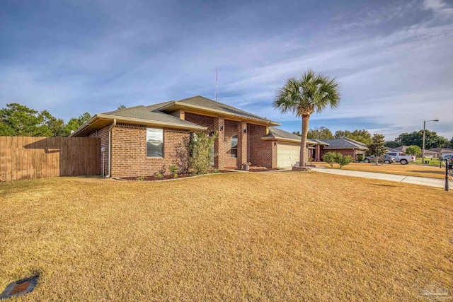 view of front of home featuring a garage and a front yard