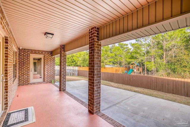 view of patio featuring a playground