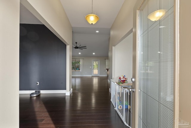 hallway with dark hardwood / wood-style floors