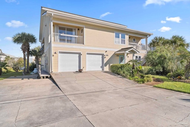 view of property featuring a balcony and a garage