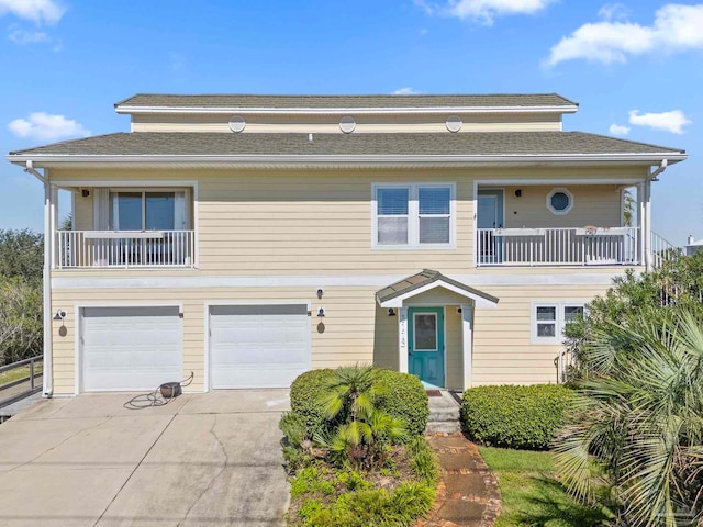 view of front of house with a balcony and a garage