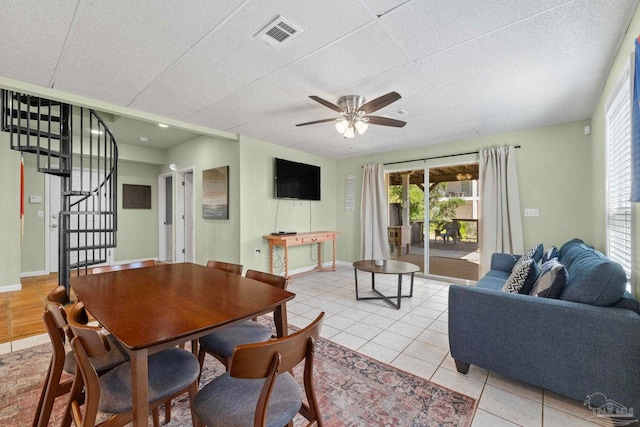1113 Via Deluna Dr, Pensacola Beach, FL 32561 - dining area with visible vents, light tile patterned flooring, a healthy amount of sunlight, stairway, and a ceiling fan