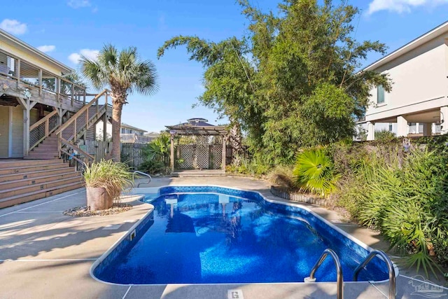 1113 Via Deluna Dr, Pensacola Beach, FL 32561 - view of pool featuring a deck, fence, a fenced in pool, a pergola, and stairs