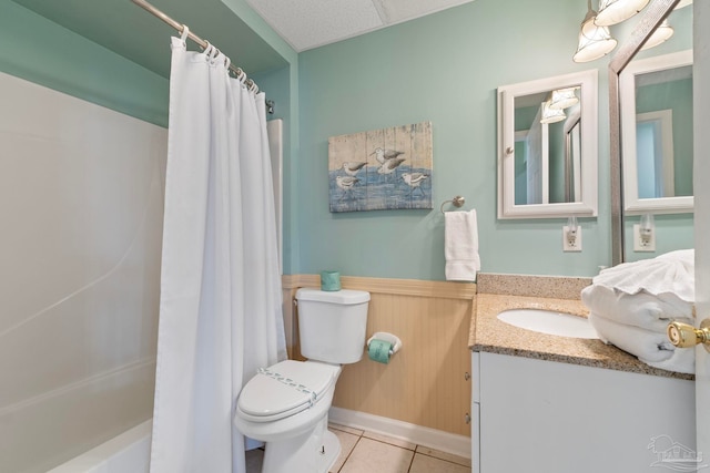 full bathroom with toilet, shower / tub combo with curtain, vanity, and tile patterned floors