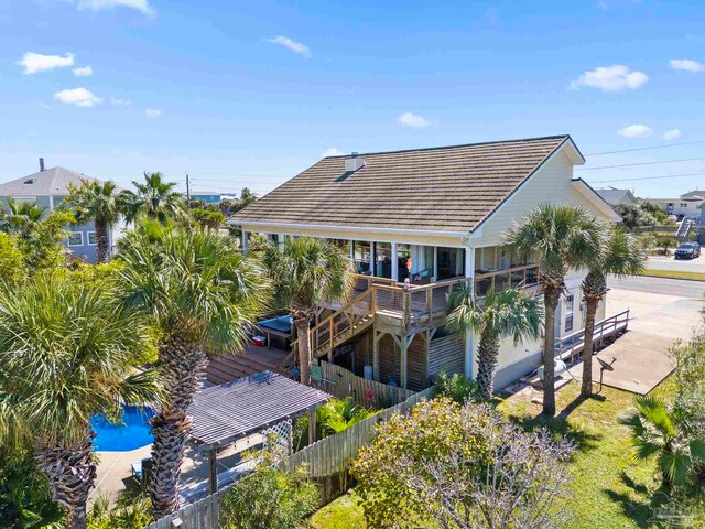 1113 Via Deluna Dr, Pensacola Beach, FL 32561 - rear view of house featuring fence and a tile roof