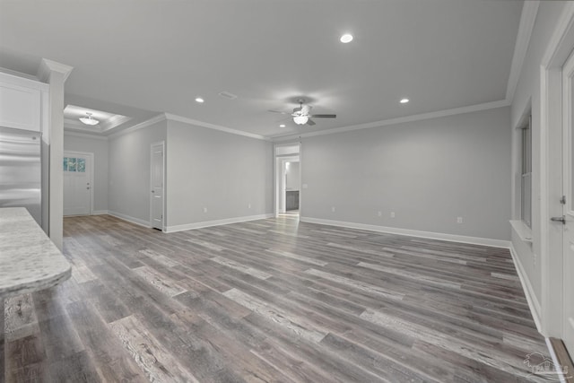 6621 Rocky Shores Rd, Milton, FL 32583 - unfurnished living room featuring ceiling fan, recessed lighting, baseboards, wood finished floors, and crown molding