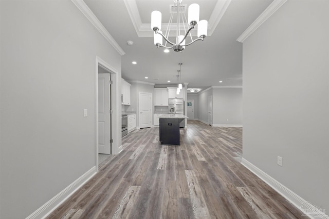 6621 Rocky Shores Rd, Milton, FL 32583 - kitchen with a chandelier, ornamental molding, wood finished floors, appliances with stainless steel finishes, and baseboards