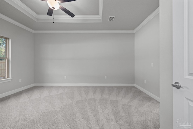 6621 Rocky Shores Rd, Milton, FL 32583 - spare room featuring crown molding, ceiling fan, carpet, baseboards, and a tray ceiling