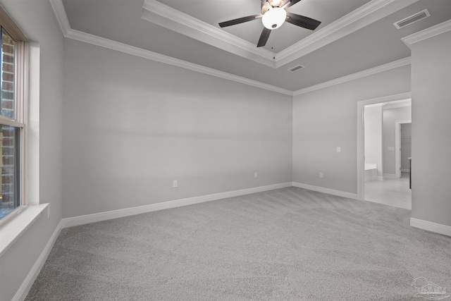 6621 Rocky Shores Rd, Milton, FL 32583 - carpeted empty room featuring a tray ceiling, plenty of natural light, ornamental molding, a ceiling fan, and baseboards