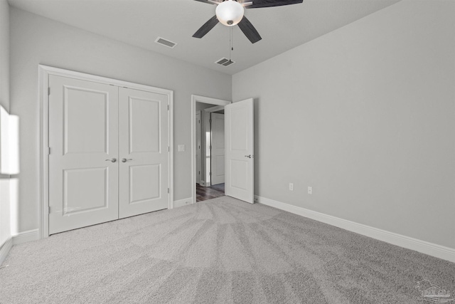 6621 Rocky Shores Rd, Milton, FL 32583 - unfurnished bedroom with carpet, baseboards, a closet, and a ceiling fan