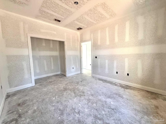 6621 Rocky Shores Rd, Milton, FL 32583 - unfurnished bedroom featuring unfinished concrete flooring, baseboards, and a closet
