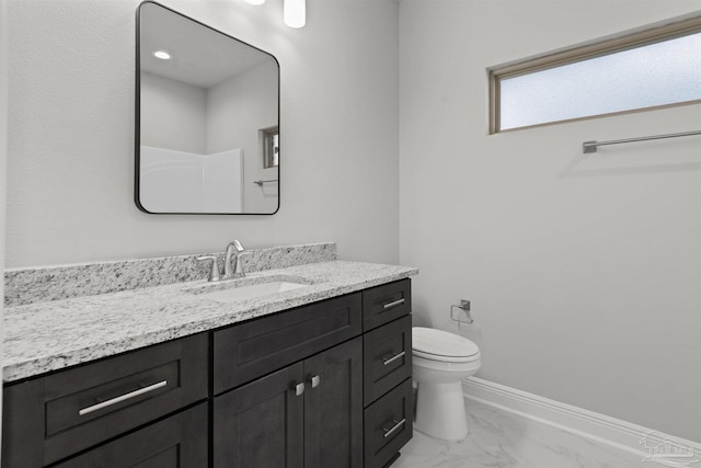 6621 Rocky Shores Rd, Milton, FL 32583 - bathroom with vanity, toilet, marble finish flooring, and baseboards