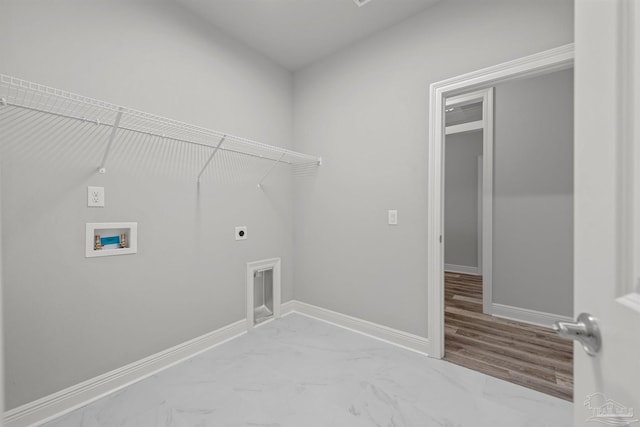 6621 Rocky Shores Rd, Milton, FL 32583 - laundry area with hookup for an electric dryer, washer hookup, baseboards, and marble finish floors