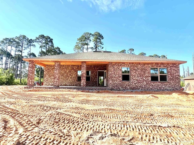 6621 Rocky Shores Rd, Milton, FL 32583 - view of front facade with brick siding and roof with shingles