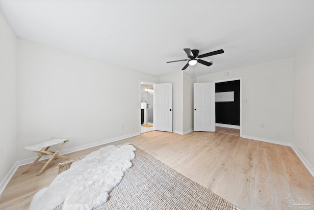 unfurnished bedroom with light wood-style floors, ceiling fan, and baseboards