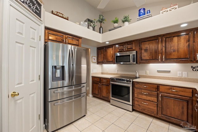 9638 Wills Ln, Lillian, AL 36549 - kitchen with appliances with stainless steel finishes, light tile patterned flooring, and light countertops
