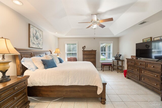 9638 Wills Ln, Lillian, AL 36549 - bedroom featuring a tray ceiling, light tile patterned floors, a ceiling fan, and recessed lighting