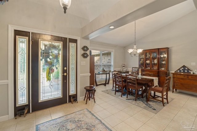 9638 Wills Ln, Lillian, AL 36549 - dining space featuring lofted ceiling, light tile patterned floors, and a chandelier
