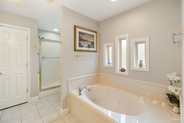 9638 Wills Ln, Lillian, AL 36549 - full bath featuring tile patterned floors, a stall shower, a whirlpool tub, and baseboards