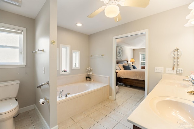 9638 Wills Ln, Lillian, AL 36549 - ensuite bathroom featuring a bath, tile patterned flooring, double vanity, toilet, and recessed lighting