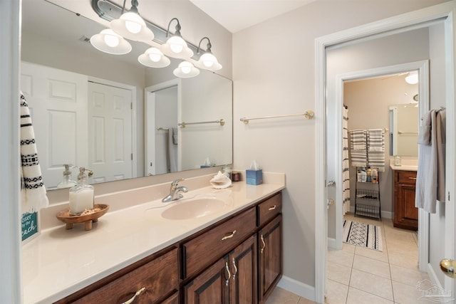 9638 Wills Ln, Lillian, AL 36549 - bathroom with tile patterned floors, vanity, and baseboards