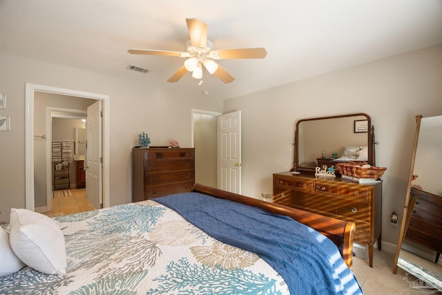 9638 Wills Ln, Lillian, AL 36549 - bedroom featuring light tile patterned floors, a ceiling fan, and connected bathroom