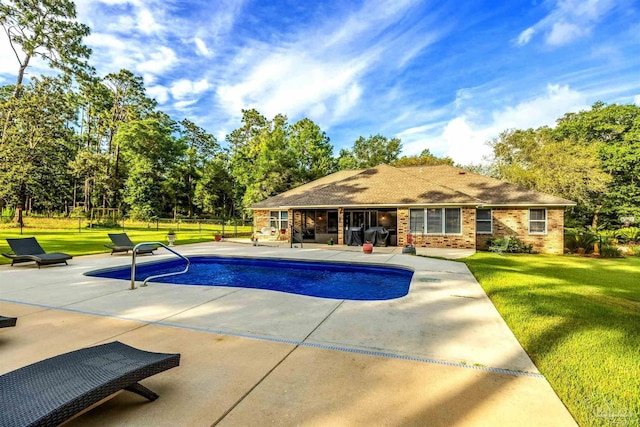 9638 Wills Ln, Lillian, AL 36549 - swimming pool featuring a patio and a lawn