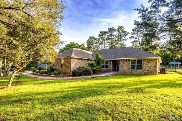 9638 Wills Ln, Lillian, AL 36549 - ranch-style home with brick siding and central air condition unit