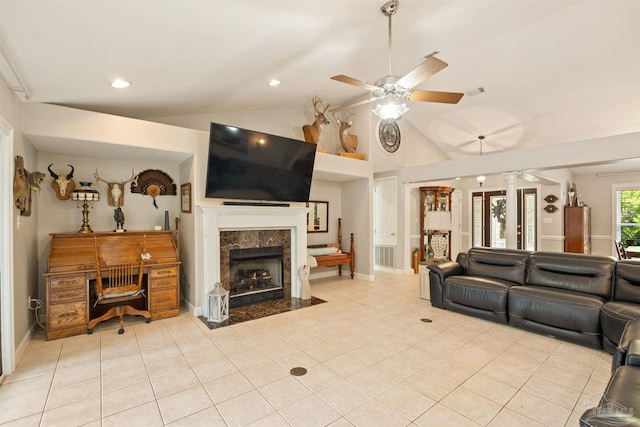 9638 Wills Ln, Lillian, AL 36549 - living area with a ceiling fan, lofted ceiling, light tile patterned flooring, a high end fireplace, and recessed lighting