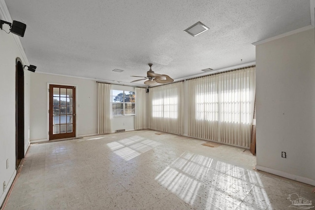 spare room featuring ceiling fan, crown molding, and a textured ceiling