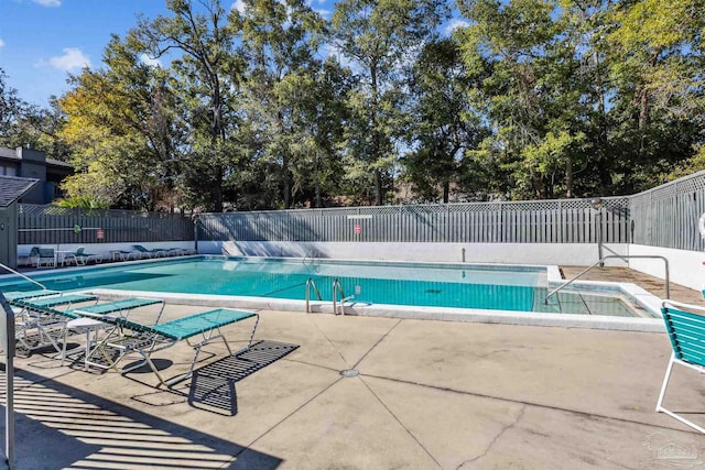 view of pool with a patio area and a jacuzzi