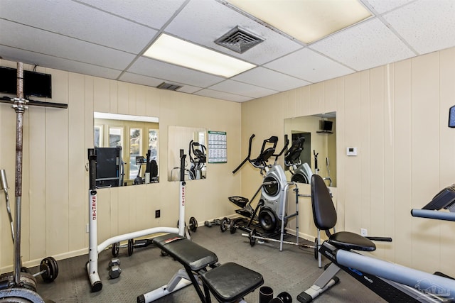 exercise area featuring a paneled ceiling