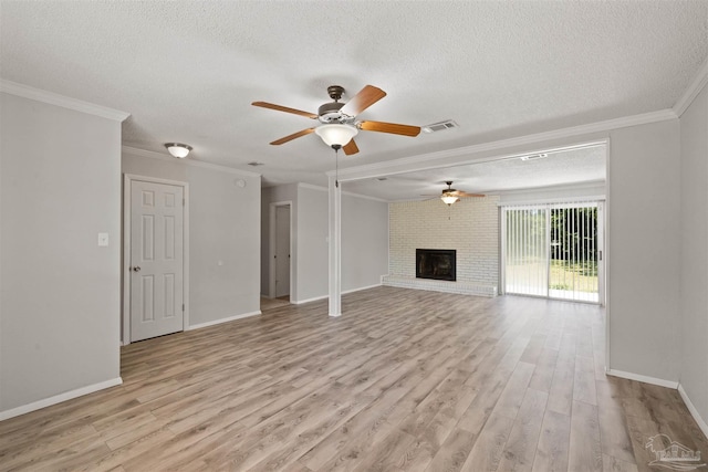2500 Inda Ave, Pensacola, FL 32526 - unfurnished living room featuring ornamental molding, light wood-type flooring, visible vents, and a fireplace