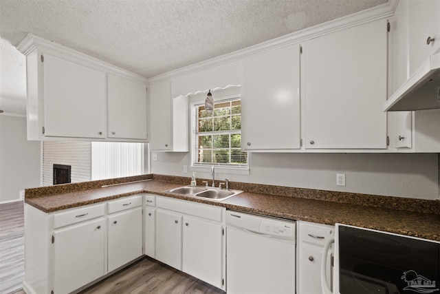 2500 Inda Ave, Pensacola, FL 32526 - kitchen with a textured ceiling, white dishwasher, a sink, a brick fireplace, and dark countertops