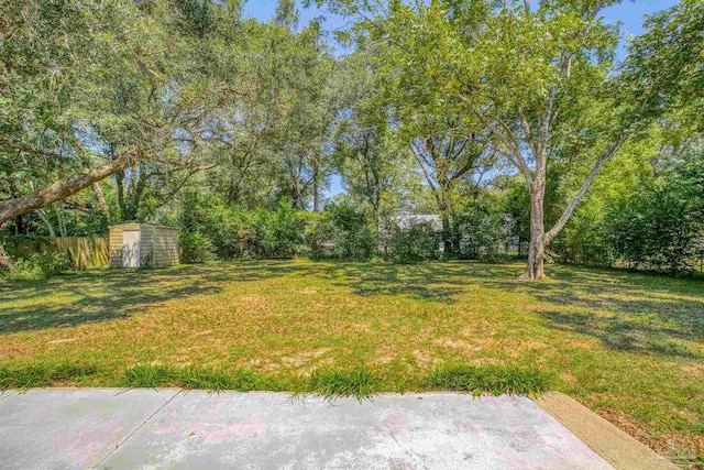 2500 Inda Ave, Pensacola, FL 32526 - view of yard featuring a storage shed, fence, and an outdoor structure
