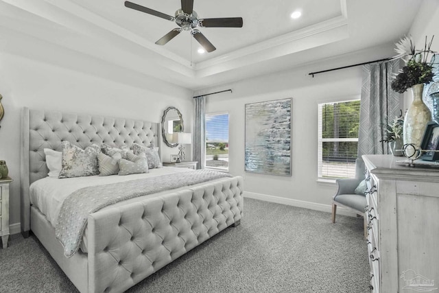 bedroom featuring carpet flooring, ceiling fan, a raised ceiling, and crown molding