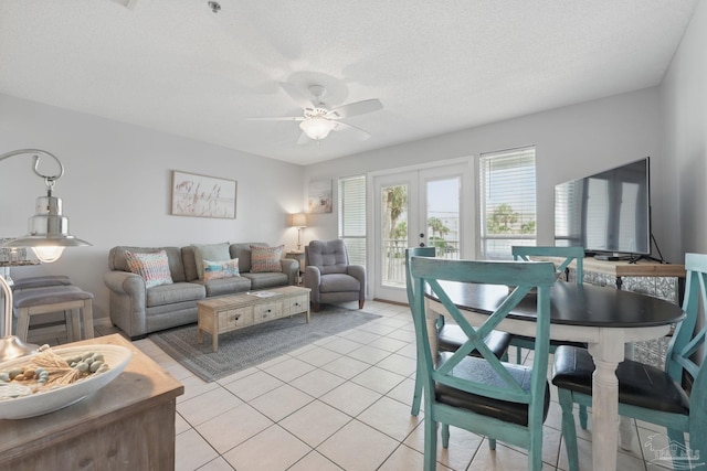 3191 Scenic Highway 98 Unit 212, Destin, FL 32541 - living room featuring french doors, light tile patterned floors, ceiling fan, and a textured ceiling