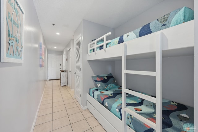 3191 Scenic Highway 98 Unit 212, Destin, FL 32541 - bedroom with tile patterned floors, recessed lighting, and a closet