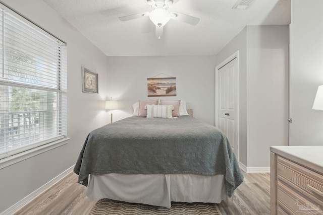3191 Scenic Highway 98 Unit 212, Destin, FL 32541 - bedroom featuring light wood-style floors, a closet, and a ceiling fan