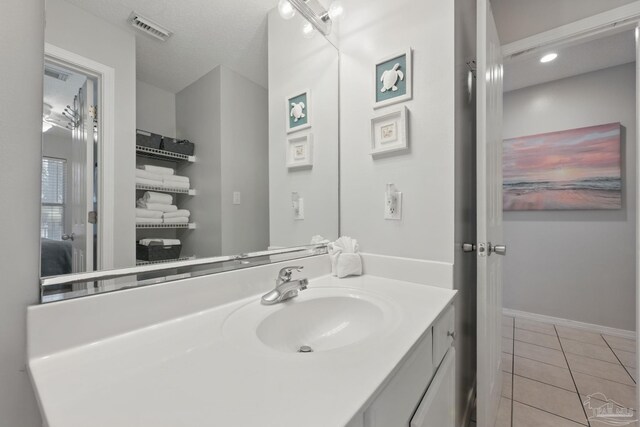 3191 Scenic Highway 98 Unit 212, Destin, FL 32541 - bathroom with vanity and tile patterned floors