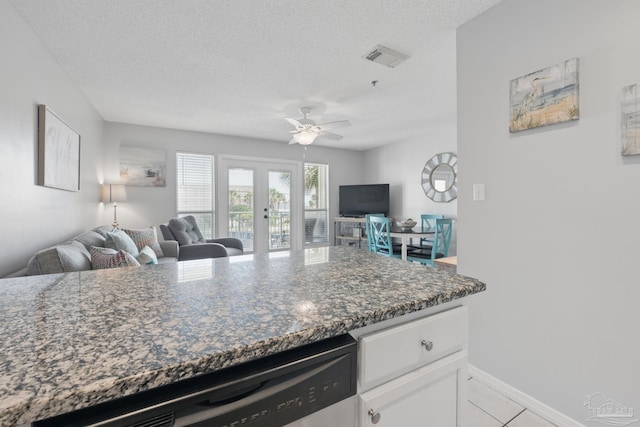 3191 Scenic Highway 98 Unit 212, Destin, FL 32541 - kitchen featuring open floor plan, a ceiling fan, a textured ceiling, white cabinetry, and french doors
