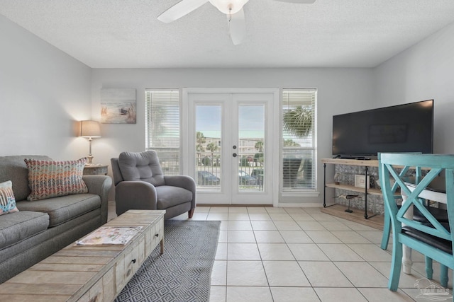 3191 Scenic Highway 98 Unit 212, Destin, FL 32541 - living area featuring french doors, ceiling fan, a textured ceiling, and light tile patterned floors