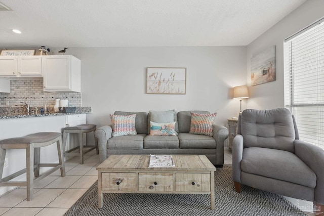 3191 Scenic Highway 98 Unit 212, Destin, FL 32541 - living room with light tile patterned floors, a textured ceiling, and recessed lighting